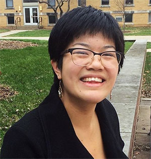 headshot of Fiona Qu, standing outside on campus