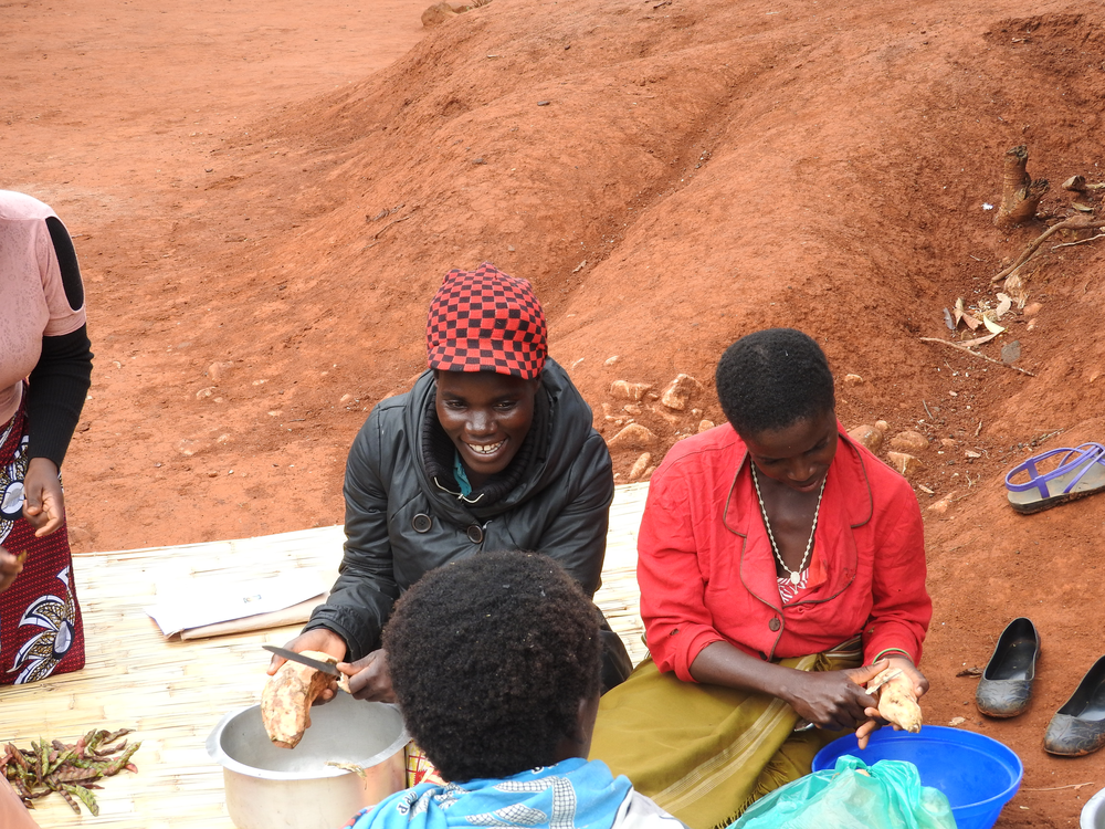 Women cook sweet potatoes for a nutritious-cooking demonstration day.