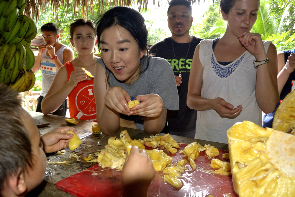 a student eating jackfruit in Costa Rica