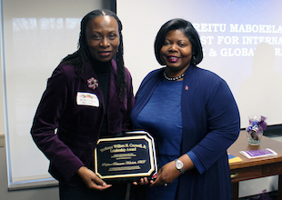 photo of vice provost mabokela with danita brown young as she receives the creswell award