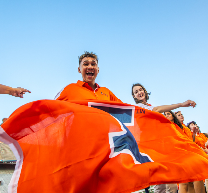 Students waving an Illinois flag